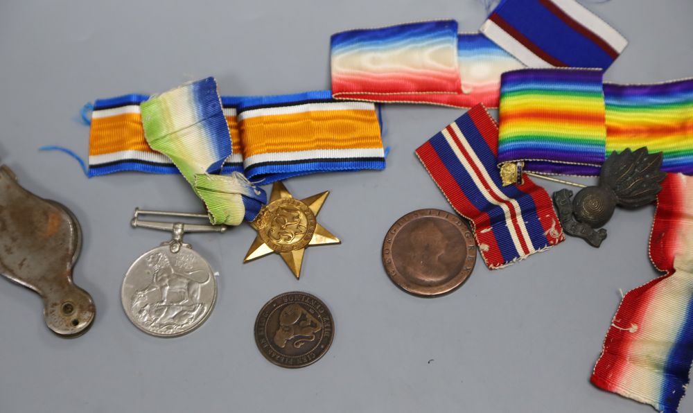 A quantity of medals and military badges
